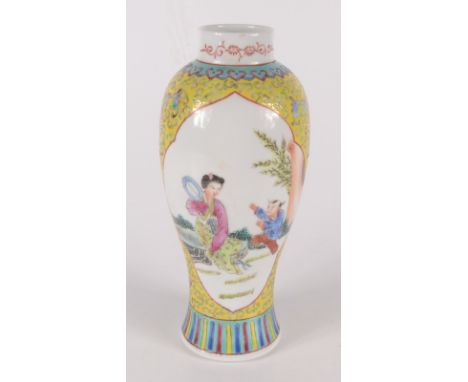 A Chinese porcelain famille rose vase, circa 1900, with four character Kangxi mark, height 23cm. 