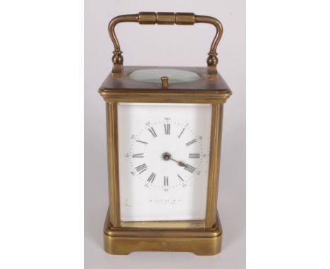 A brass repeater carriage clock, the white enamel dial with roman numerals, height 11cm, width 6.8cm, depth 7.2cm. Condition 