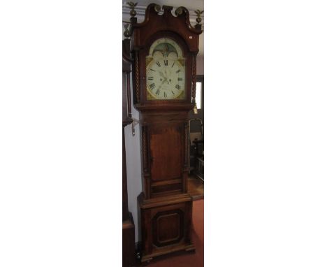 An oak and mahogany eight day longcase clock, the arched painted dial by Matthews Welshpool, the rolling moon arch also paint