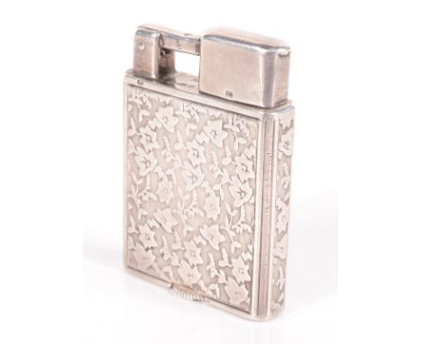 A silver George Stockwell small Everest cigarette lighter with leaf decoration, London import mark for 1929. Condition report