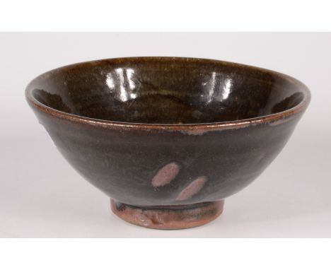 A Trevor Corser Leach pottery footed bowl, the tenmoku glaze with abstract decoration, impressed personal and pottery seals, 