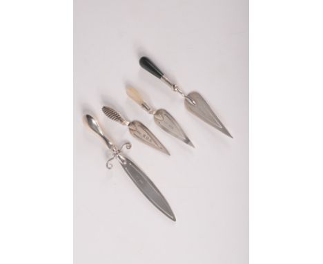 A silver rapier bookmark and three silver bookmarks of trowel shape.