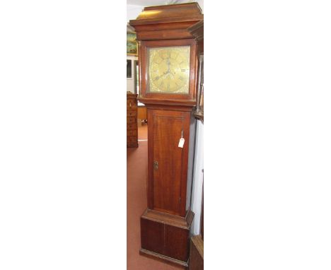 A George III oak eight day longcase clock, the square brass dial signed Maurice Thomas Caernarvon, above a rectangular solid 