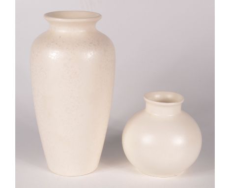 A Poole pottery baluster vase, with a white mottled ground, height 20.5cm and a white ground squat vase, height 10cm. 