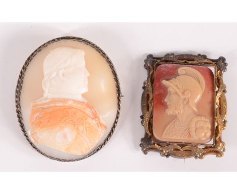 A carved shell, silver mounted cameo brooch with a portrait of a pontiff, together with a gold mounted cameo brooch carved wi