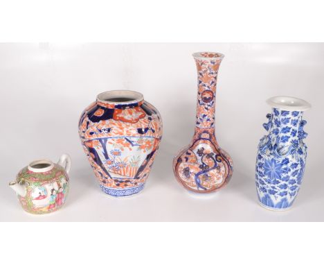 A Chinese Imari porcelain bottle vase, 19th century, height 26.5cm, a Chinese Canton teapot, height 8.5cm, a Chinese blue and