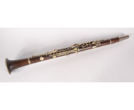 A clarinet, indistinct impressed mark, length 65cm.