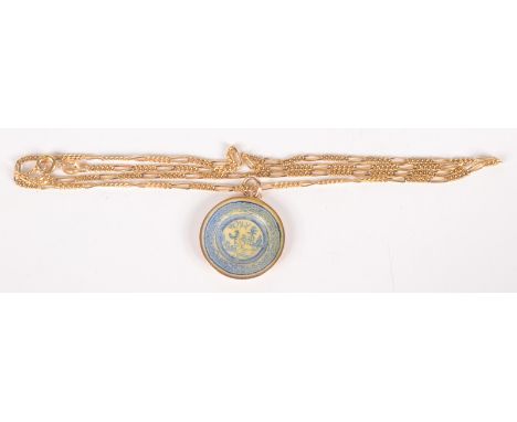 A 9ct gold willow pattern pendant with blue and white enamel on 9ct gold chain.