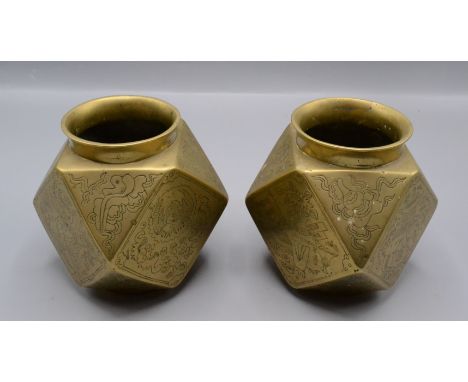 A pair of Chinese brass faceted vases, late 19th/early 20th century, each with seal mark to base, height 13cm, width 10.5cm.