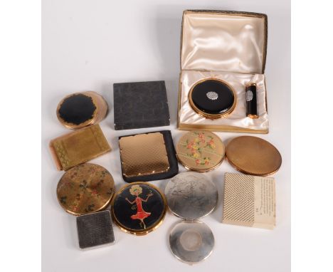 A Japanese silver compact and other compacts.