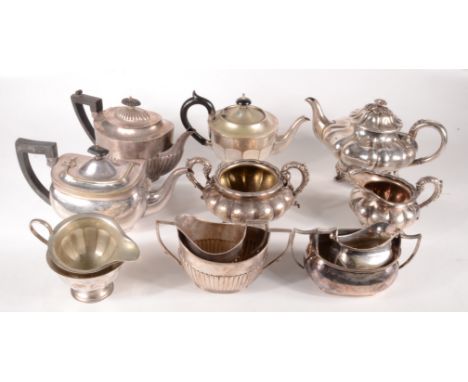 A George IV Sheffield plated three piece tea service, together with three other plated tea services. 