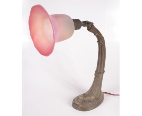 An Art Nouveau adjustable metal table lamp, with frosted pink glass shade, height 41cm. Condition report: Split to metal base