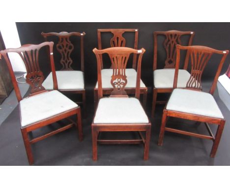 A harlequin set of six Chippendale style dining chairs with pierced vase splats and drop in seats.