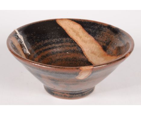 A Trevor Corser Leach pottery footed bowl, the tenmoku glaze with abstract decoration to the interior, impressed personal and