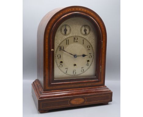 An inlaid mahogany mantle clock, early 20th century, the German movement signed Kienzle, the case with satinwood patera inlay