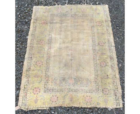 A Turkish silk prayer rug, the mihrab with a hanging lantern flanked by pillars, within a green angular serrated vine and pal