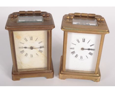 A French brass carriage clock, early 20th century, height of case 10.1cm, width 8cm, depth 6.5cm and another similar carriage