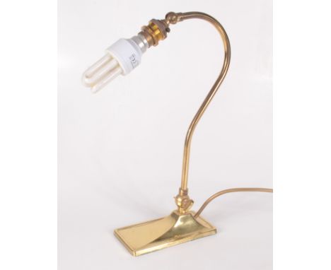 A brass adjustable table lamp, height 34.5cm, width of base 7.5cm, depth of base 15cm.