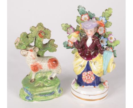 A Staffordshire pottery figure of a sheep and tree, early 19th century, gilt painted half circle and arrow mark, height 10.6c