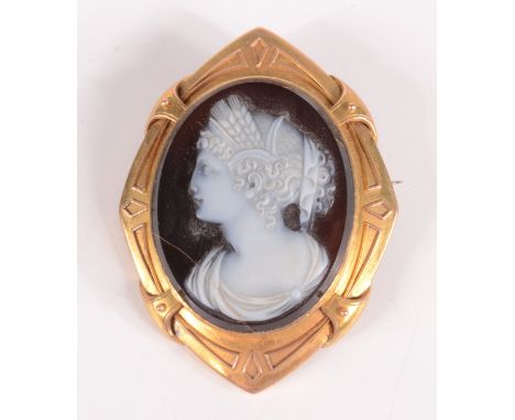 A 19th century classical carved hardstone cameo female portrait in high purity gold brooch mount, cameo cracked.