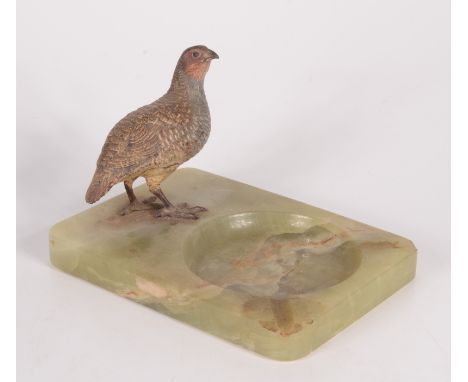 A continental cold painted bronze model of a pheasant, on a green onyx base, height 11cm, width 17cm, depth 12.5cm. 