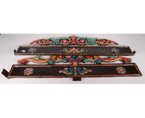 Five painted cast iron architectural mounts, largest height 25cm, length 90cm. 