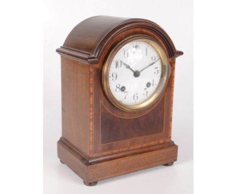 An inlaid mahogany mantle clock, early 20th century, the white enamel circular dial inscribed 'MFD.by Ansonia Clock Co. N.Y. 