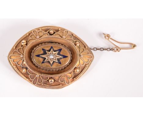 A Victorian high purity gold mourning brooch in Revivalist style, at the centre a pearl and black enamel star. 