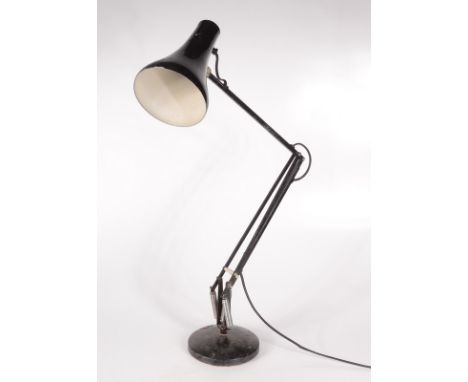 A black anglepoise lamp. 