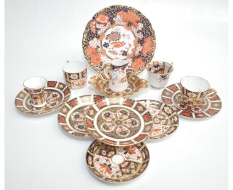 A selection of Royal Crown Derby porcelain, including a plate, diameter 22cm, a cream jug, cups and saucers etc. 