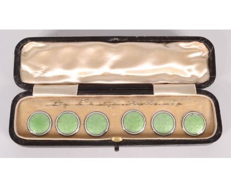 A set of six enamelled silver buttons, cased.  Condition report: All but one button have slight damage.