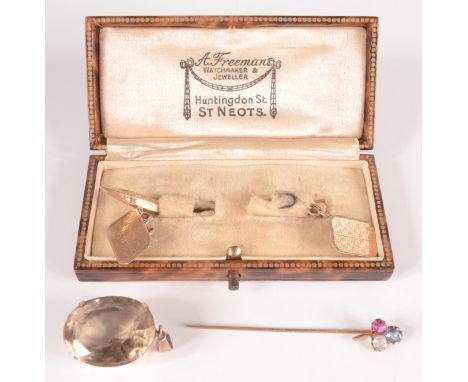 A pair of 9ct gold cuff-links, a gold stick pin and a gold mounted topaz pendant. 