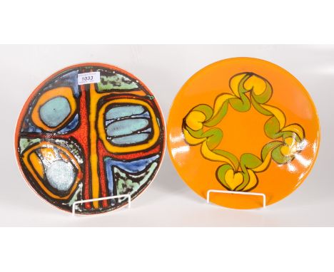 Two Poole pottery shallow dishes, each with geometric designs, diameters 26.5cm and 26.7cm.    Condition report:  Crazing to 