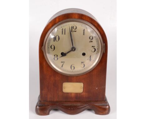 A mahogany mantle clock, the silvered 14cm dial with arabic numerals, height 29.5cm, width 21.5cm, depth 13cm.