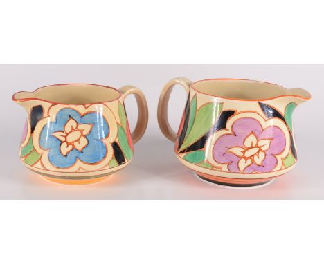 Two Clarice Cliff Bizarre Fantasque jugs, each hand painted with flowers amongst foliage, with Lawleys gold backstamp, height