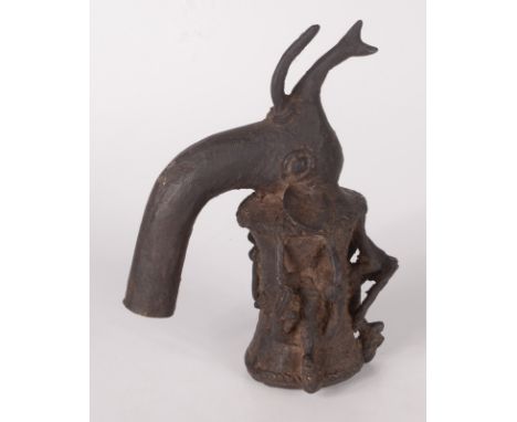 An African bronze pipe, in the form of an elephant's head, the bowl with three seated musicians, 18 x 14cm.
