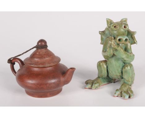 A Chinese Yixing miniature teapot, seal mark to base height 6.5cm, handle to spout 9.5cm and a celadon glazed pottery figure 