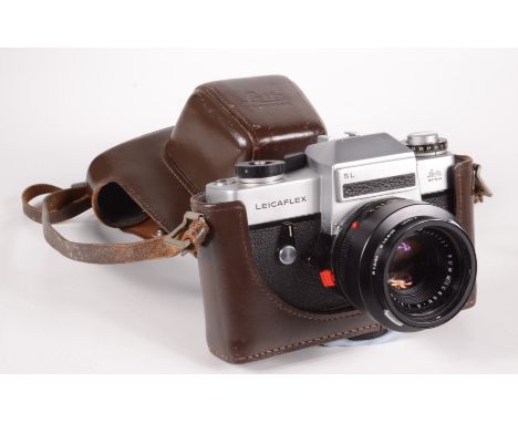 A Leitz Leicaflex SL camera, with Summicron lens No.12564K, in original brown leather case.  Condition report: Speeds all app