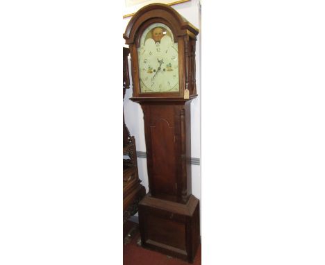 A mahogany eight day longcase clock, 19th century, the rolling moon arched dial painted with cottages, flanked by turned colu