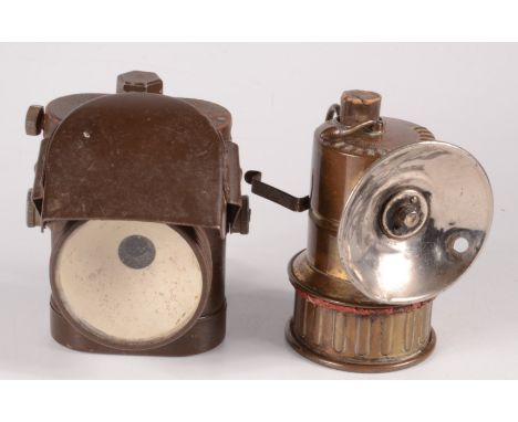 A P & H brass lamp No.72, height 10.4cm and another lamp 'Lamps Electric No.1 J.L. Ltd military lamp', height 11.5cm. 