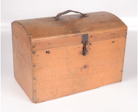 A pine domed top trunk, of small proportions, with a leather handle, height 28cm, width 41cm, depth 23.5cm.