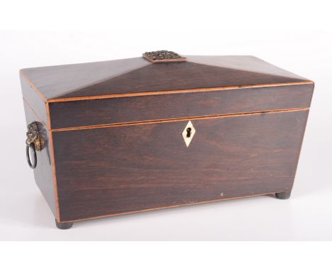 A Regency mahogany tea caddy with gilt metal lion mask handles and floral finial, height 17cm, width 31.5cm, depth 15cm.  Con