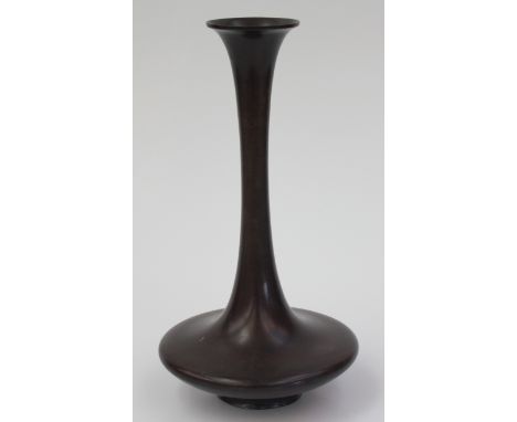 A Japanese bronze vase, the flared rim above a slender narrow neck and squat body, height 31cm, diameter of base 7cm.  Condit