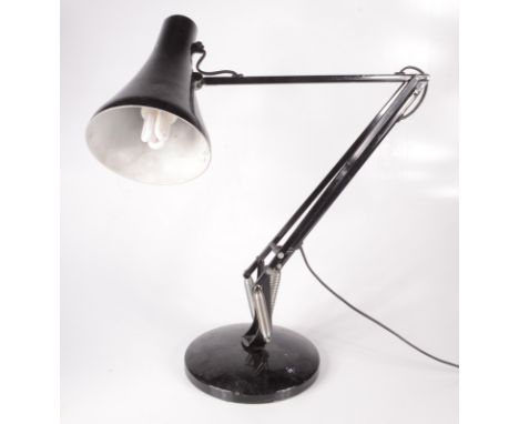 A black anglepoise lamp.  