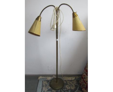 A brass standard lamp, 1960s/70s, with twin shades, height 125.5cm, width 77cm.