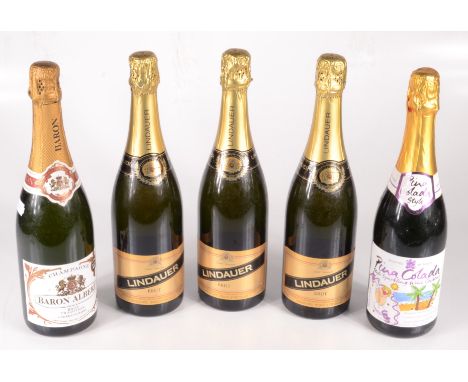 Three bottles of Lindauer Brut sparkling wine, a bottle of Baron Albert champagne and a bottle of Pina Colada style sparkling