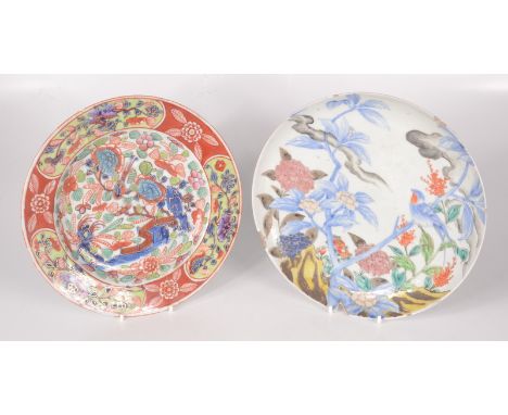 A Chinese famille rose porcelain plate, 19th century, decorated with a bird perched on a flowering branch, blue character mar