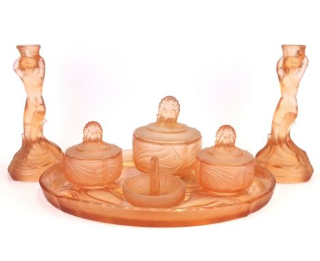 An Art Deco peach glass dressing table set decorated with mermaids, tray W. 35cm candlestick H. 22cm.