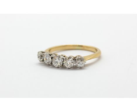 A yellow metal (tested 18ct gold) ring set with five brilliant cut diamonds, approx. 1.10ct overall, (J).