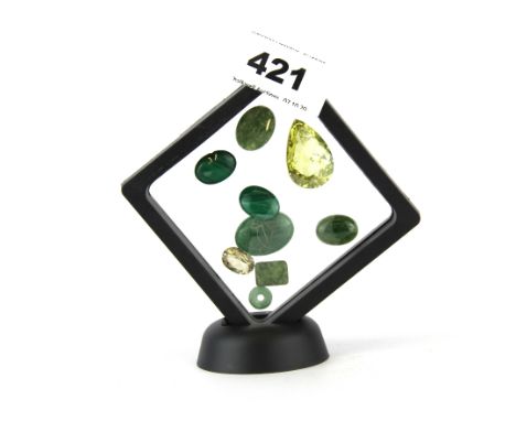 A large tear drop shaped citrine with jade and malachite.